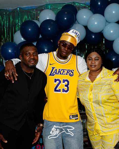 Lesley Ugochukwu with his parents on his 20th birthday photoshoot.