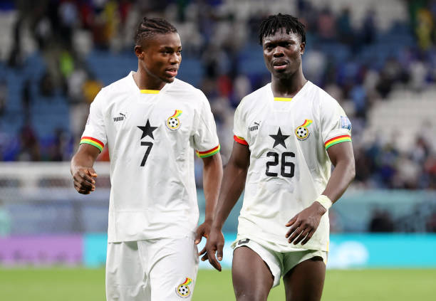 Abdul Fatawu and Saidu wearing Ghanaian national team jersey 